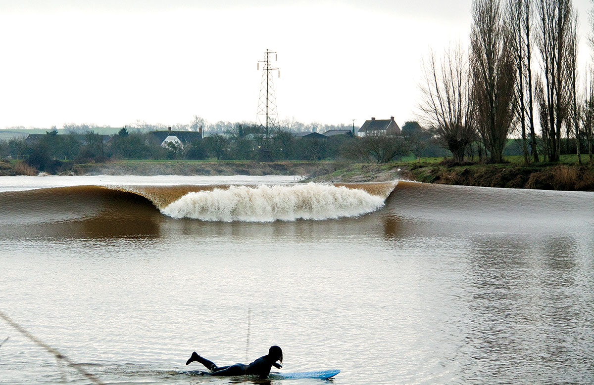 Photo of high wave surging up river